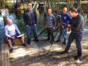 doc diver students with camera topside